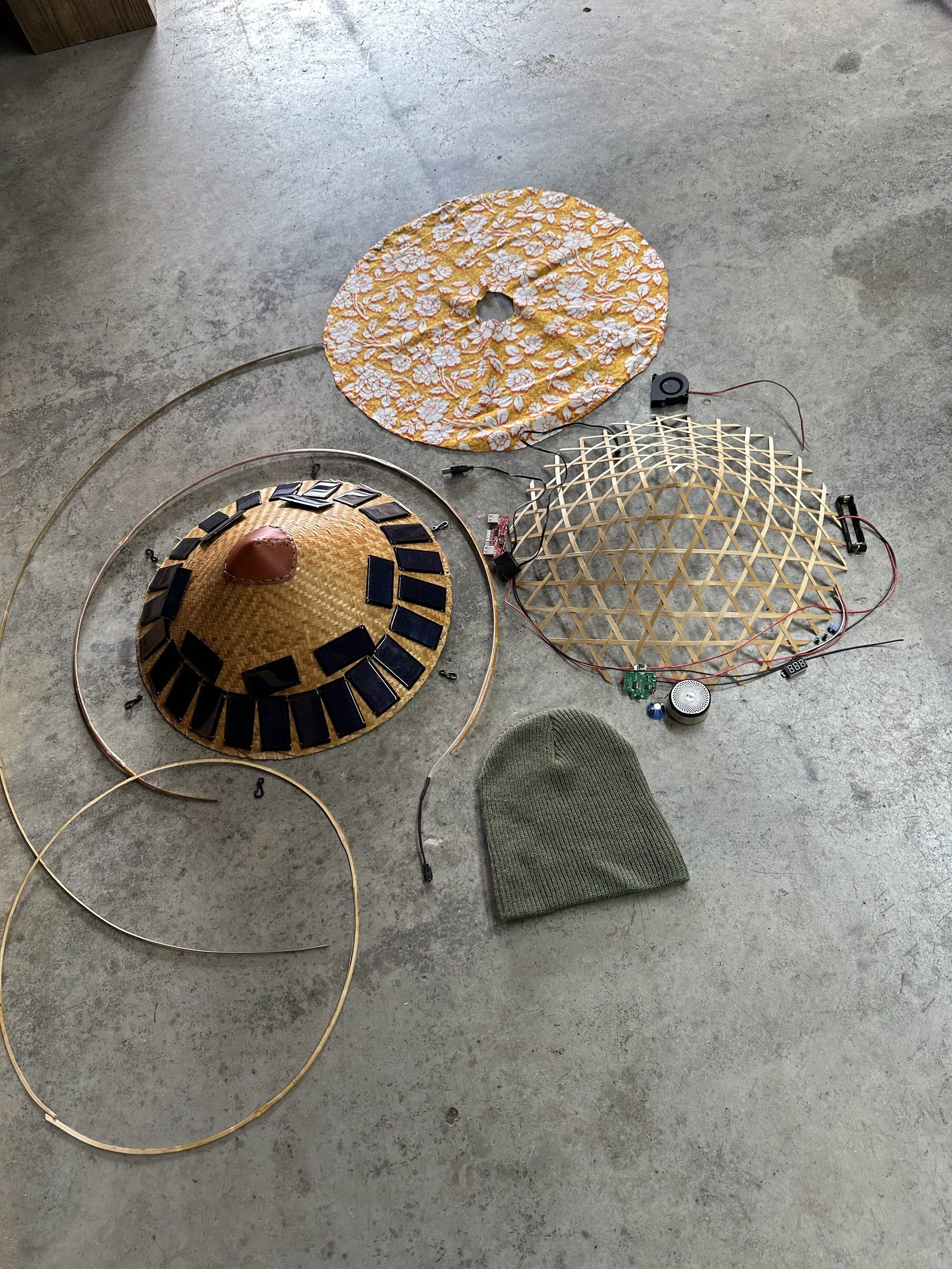 Solar Hat solar hat components — straw hat with solar panels, bamboo frame, speaker, and electronics
